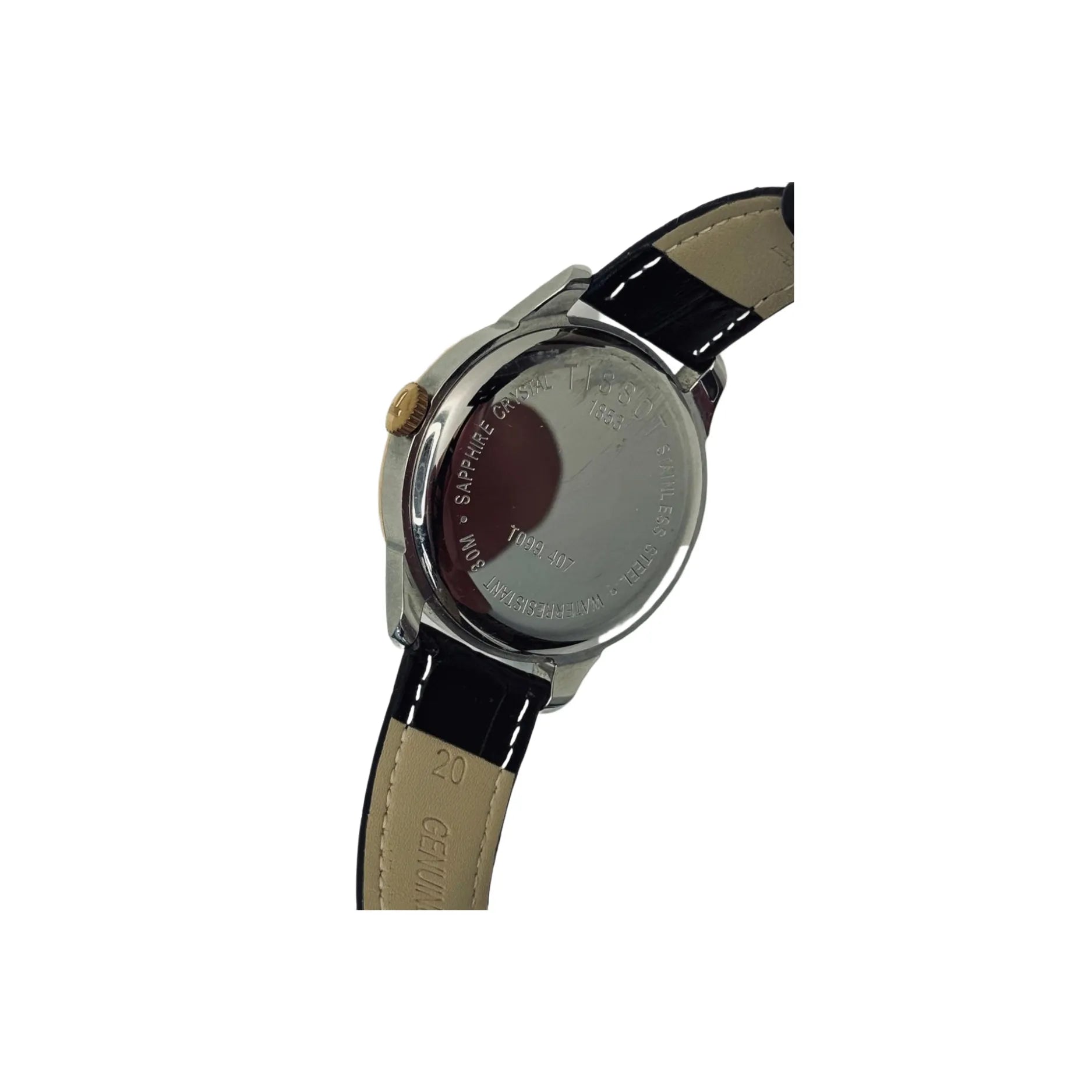 Back view of a Tissot wristwatch with black leather strap and engraved stainless steel case